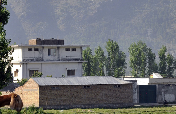 Pakistani police stand guard outside the hideout of Al-Qaeda leader Osama bin Laden who was killed by US Special Forces in a ground operation early May 2. (REUTERS)
