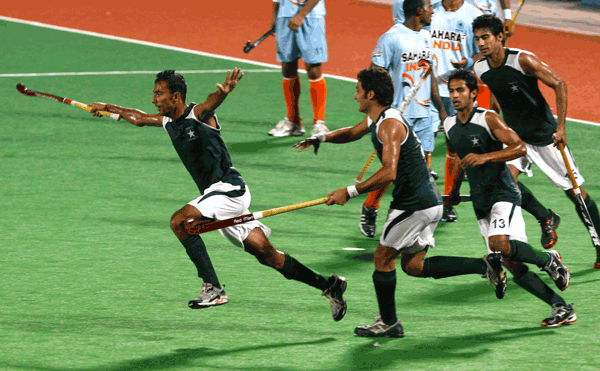 Pakistan's Muhammad Umar Bhutta (left) celebrates after scoring a goal against India during their match at the Sultan Azlan Shah Cup in Ipoh, Malaysia on Wednesday. (AP)