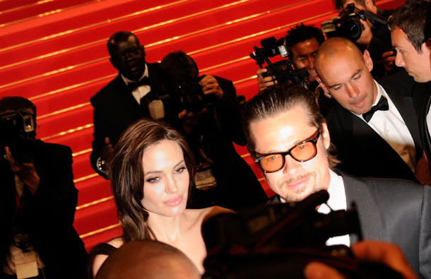 Actress Angelina Jolie and actor Brad Pitt depart "The Tree Of Life" premiere during the 64th Annual Cannes Film Festival at Palais des Festivals on May 16, 2011 in Cannes, France. (GETTY/GALLO)