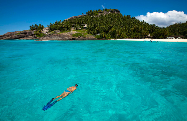 A swimmer off North Island resort in the Seychelles, an archipelago in the Indian Ocean. (AP)