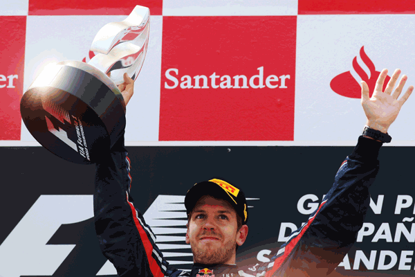 Sebastian Vettel of Germany and Red Bull Racing celebrates on the podium after winning the Spanish Formula One Grand Prix at the Circuit de Catalunya on Sunday in Barcelona, Spain. (GETTY)