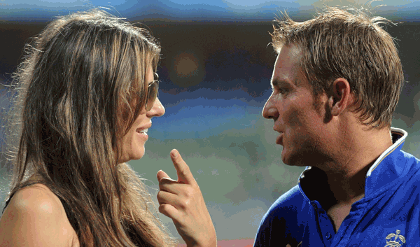Australian bowling legend and Rajasthan Royals' captain Shane Warne speaks with his girlfriend British actress Elizabeth Hurley after his last international match in the IPL. (AFP)