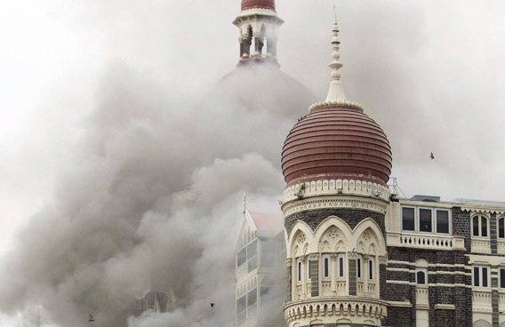 Smoke billows from the landmark Taj Mahal hotel in Mumbai, India. (AP)