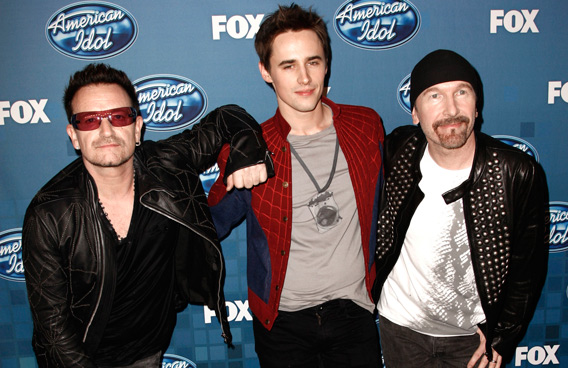 From left, Bono, Reeve Carney, and The Edge are seen backstage at the "American Idol" finale, in Los Angeles. (AP)