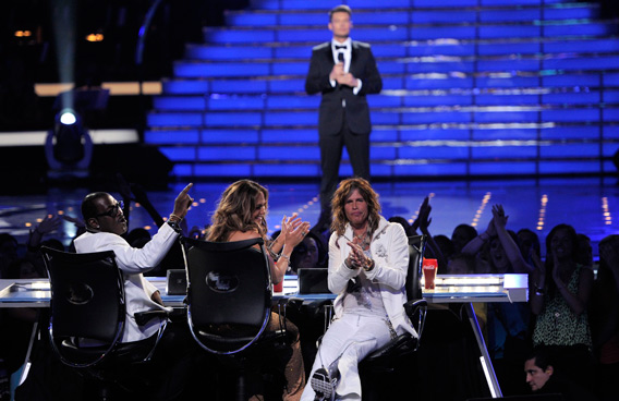 From left, judges Randy Jackson, Jennifer Lopez, Steven Tyler, and host Ryan Seacrest, in background, are seen at the American Idol Finale, in Los Angeles. (AP)