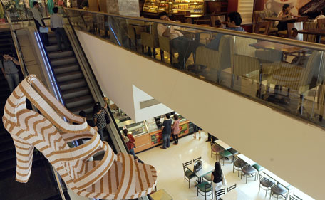 An oversized high-heeled shoe installation, made from 15,000 sticks of cigarettes by anti-tobacco campaigners, is displayed inside a shopping mall on the eve of World Anti-Tobacco Day in Mumbai on May 30, 2010. India is the world's second-largest producer and consumer of tobacco behind China, according to the American Cancer Society and the World Lung Foundation. (AFP)