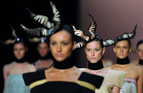 Models present creations by Acquastudio, during the Rio Fashion Week, Summer 2012 collection, at the Pier Maua, in Rio de Janeiro, Brazil. (AFP)