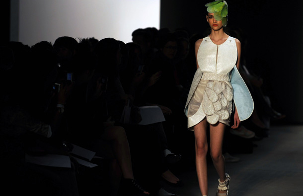 A model presents a creation by designer Melk Z-Da during the Rio Fashion Week, Summer 2012 collection, at the Pier Maua, in Rio de Janeiro, Brazil. (AFP)
