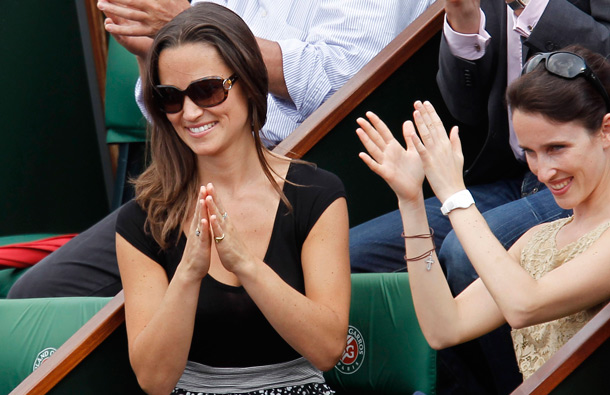 Pippa Middleton, sister of Kate, Duchess of Cambridge, left, watches Sweden's Robin Soderling playing France's Gilles Simon during their fourth round match of the French Open tennis tournament, at the Roland Garros stadium in Paris. (AP)