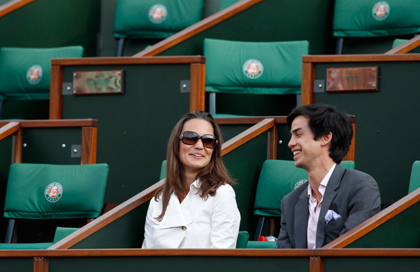 Pippa Middleton, sister of Kate, Duchess of Cambridge, watches Maria Sharapova of Russia play against Agnieszka Radwanska of Poland in the fourth round match at the French Open tennis tournament in Roland Garros stadium in Paris. (AP)