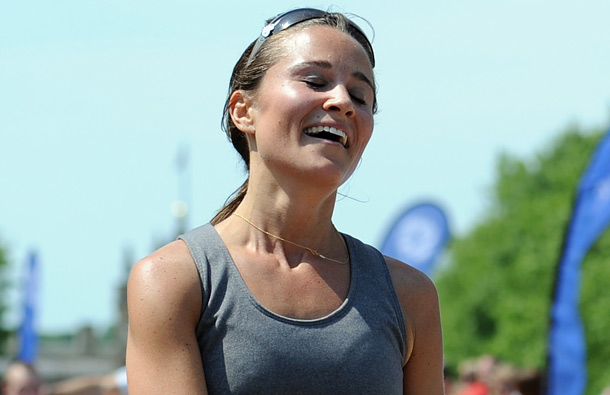 Pippa Middleton reacts after crossing the finish line during the GE Blenheim Triathlon at Blenheim Palace in Woodstock, England. (GETTY/GALLO)