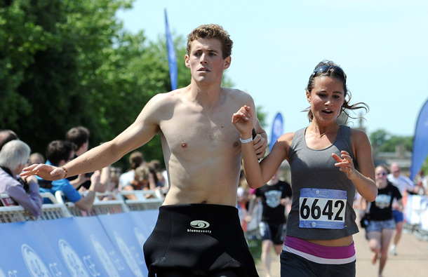 Pippa Middleton(R) crosses the finish line during the GE Blenheim Triathlon at Blenheim Palace in Woodstock, England. (GETTY/GALLO)