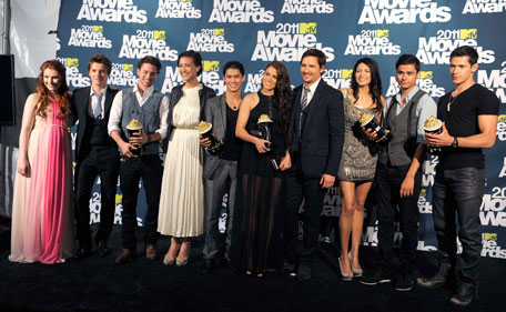 The cast of "Teen Wolf," from left, Tyler Hoechlin, Tyler Posey, Dylan O'Brien, Holland Roden, Crystal Reed, and Colton Haynes are seen backstage at the MTV Movie Awards on Sunday, June 5, 2011, in Los Angeles. (AP)