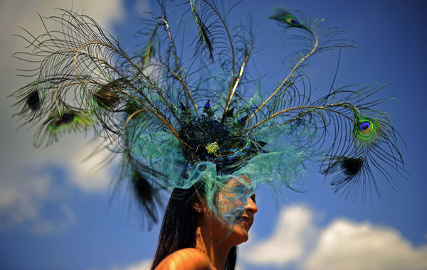 A racegoer wearing an elaborate hat is pictured on the first day of the annual Royal Ascot horse racing event near Windsor, Berkshire, west of London. (AFP)