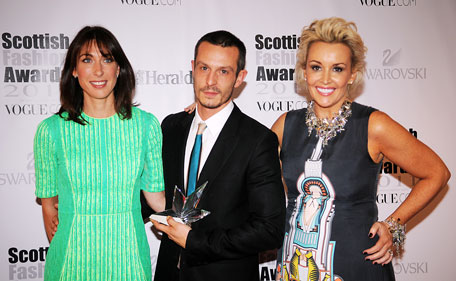 Samantha Cameron poses with Jonathan Saunders, Scottish Designer of the Year and Tessa Hartman, founder and organiser of the Scottish Fashion Awards at Glasgow Science Centre on June 15, 2011 in Glasgow, Scotland. (GETTY)