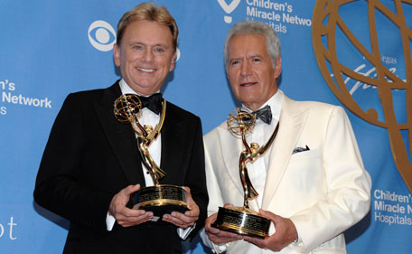 Television personality Pat Sajak, left, and, television personality Alex Trebek pose together with their awards in the press room at the 38th Annual Daytime Emmy Awards in Las Vegas on Sunday, June 19, 2011. Sajak and Trebek both received Lifetime Achievement Awards. (AP)