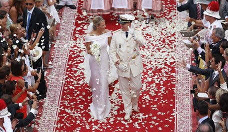 Princess Charlene of Monaco and Prince Albert Of Monaco smile as they leave the palace after the religious ceremony of the Royal Wedding of Prince Albert II of Monaco to Charlene Wittstock in the main courtyard at Prince's Palace on July 2, 2011 in Monaco, Monaco. The Roman-Catholic ceremony follows the civil wedding which was held in the Throne Room of the Prince's Palace of Monaco on July 1. With her marriage to the head of state of the Principality of Monaco, Charlene Wittstock will become Princess consort of Monaco and gain the title, Princess Charlene of Monaco. Celebrations including concerts and firework displays are being held across several days, attended by a guest list of global celebrities and heads of state.  (GETTY IMAGES)