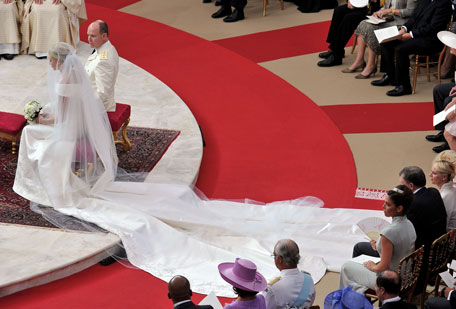 (L-R) Princess Charlene of Monaco and Prince Albert Of Monaco attend the religious ceremony of the Royal Wedding of Prince Albert II of Monaco to Charlene Wittstock in the main courtyard at Prince's Palace on July 2, 2011 in Monaco, Monaco. The Roman-Catholic ceremony follows the civil wedding which was held in the Throne Room of the Prince's Palace of Monaco on July 1. With her marriage to the head of state of the Principality of Monaco, Charlene Wittstock will become Princess consort of Monaco and gain the title, Princess Charlene of Monaco. Celebrations including concerts and firework displays are being held across several days, attended by a guest list of global celebrities and heads of state. (GETTY IMAGES)