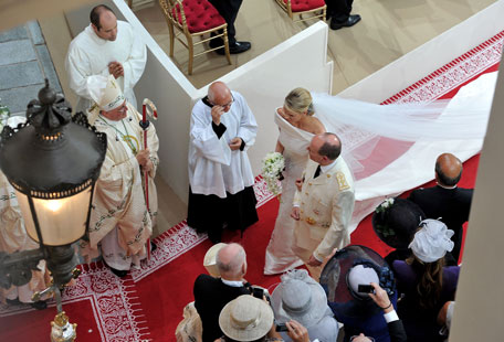 (L-R) Princess Charlene of Monaco and Prince Albert Of Monaco leave the church after the religious ceremony of the Royal Wedding of Prince Albert II of Monaco to Charlene Wittstock in the main courtyard at Prince's Palace on July 2, 2011 in Monaco, Monaco. The Roman-Catholic ceremony follows the civil wedding which was held in the Throne Room of the Prince's Palace of Monaco on July 1. With her marriage to the head of state of the Principality of Monaco, Charlene Wittstock will become Princess consort of Monaco and gain the title, Princess Charlene of Monaco. Celebrations including concerts and firework displays are being held across several days, attended by a guest list of global celebrities and heads of state.  (GETTY IMAGES)