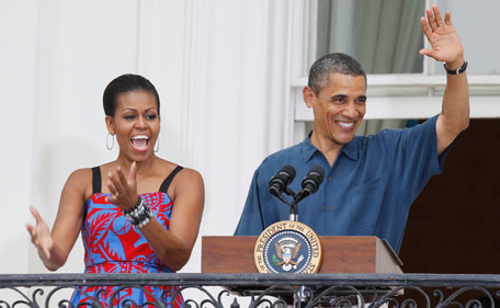 President Barack Obama and first lady Michelle Obama welcome military families to an Independence Day celebration on the South Lawn of the White House in Washington, Monday, July 4, 2011. (AP)