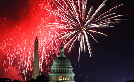 Fireworks light up the sky over the United States Capitol dome and the Washington Monument as the U.S. celebrates its 235th Independence Day in Washington July 4, 2011. (REUTERS)