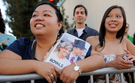 Cammie Nguyen, left, of Garden Grove, Calif., waits for the arrival of Prince William and Kate, the Duke and Duchess of California, at the inaugural BAFTA Brits to Watch 2011 event at the Belasco Theater in Los Angeles, Saturday, July 9, 2011. Prince William and Kate attended the event as part of their visit to California. (AP)