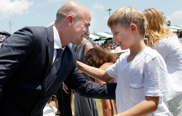 Tennis great Andre Agassi greets his son, Jaden, 9, after being inducted to the International Tennis Hall of Fame in Newport, R.I.(AP)