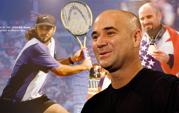 Tennis great Andre Agassi reacts as he looks at an exhibit dedicated to him at the International Tennis Hall of Fame, Friday, July 8, 2011, in Newport, R.I. Agassi will be inducted into the Hall of Fame on Saturday. (AP)