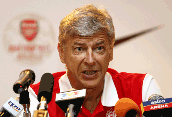 Arsenal manager Arsene Wenger speaks during a press conference at a hotel in Kuala Lumpur, Malaysia, on Monday. (AP)