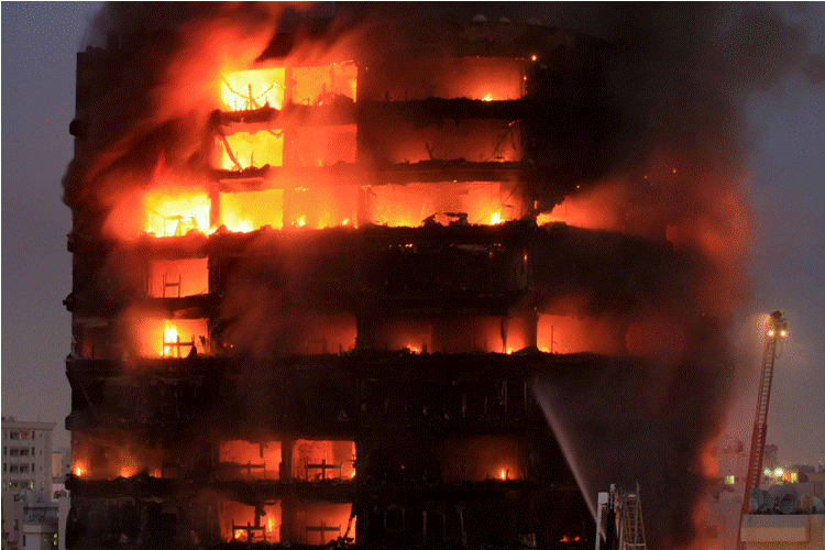 Almost exactly a year ago, on July 6, 2010, a massive fire raged at the Kuwait Tower building in Butina along Sharjah-Ajman road. (CHANDRA BALAN)