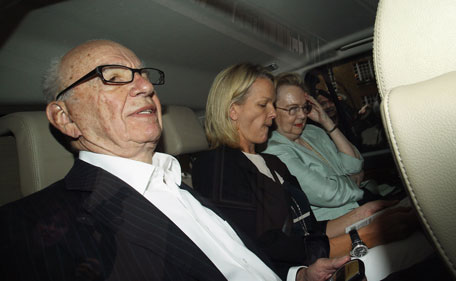 Rupert Murdoch (L), the chief executive officer of News Corp., is driven from his apartment on July 12, 2011 in London, England. Allegations emerged yesterday that private investigators working for The Sun and The Sunday Times newspapers, owned by Mr Murdoch's company, targeted former Prime Minister Gordon Brown to obtain bank details and his son's medical records. (GETTY)