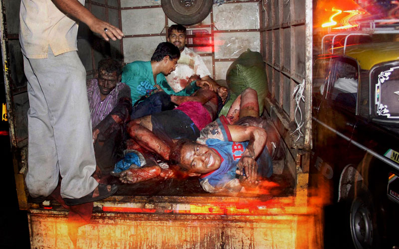 Injured people seen in this TV frame grab after a bomb blast in Mumbai on Wednesday (AFP)