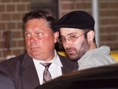 Levi Aron (right), the suspect accused killing and dismembering 8-year-old Brooklyn boy Leiby Kletzy, is led into the 67th Precinct by police, on Thursday, July 14, 2011, in the Brooklyn borough of New York. Police Commissioner Raymond Kelly said the 35-year-old suspect made statements implicating himself in the boy's death. Formal charges are pending (AP)