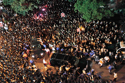 The hearse carrying the coffin of Leiby Kletzy, the 8-year-old Brooklyn boy who was killed and dismembered by a stranger he had asked for directions, leaves his funeral service, on Wednesday, July 13, 2011 in the Brooklyn borough of New York. Police Commissioner Raymond Kelly said the 35-year-old suspect, Levi Aron, made statements implicating himself in the boy's death (AP)