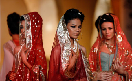 Models display creations by Indian designers Mira and Muzaffar Ali during Delhi Couture Week 2011, in New Delhi, India, Saturday, July 23, 2011. (AP)