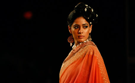 A model displays a creation by Indian designers Mira and Muzaffar Ali during Delhi Couture Week 2011, in New Delhi, India, Saturday, July 23, 2011. (AP)