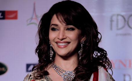 Bollywood actor Madhuri Dixit poses for the media after Indian designer Varun Bahl show during Delhi Couture Week 2011, in  New Delhi, India, Friday, July 22, 2011.  (AP)
