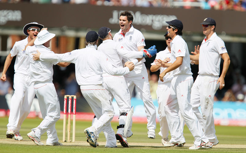 England's James Anderson, centre,  celebrates after taking the wicket of India's Sachin Tendulkar lbw, during the fifth day of the first Test Match at Lord's Cricket ground in London. (AP)