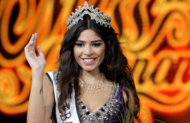 Yara Khoury Mikael, newly crowned Miss Lebanon 2011, waves to audience after winning the Miss Lebanon 2011 contest, in Beirut, Lebanon. (AP)