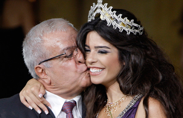 Newly crowned Miss Lebanon 2011 Yara Khoury Mikael receives kiss from her father after winning the Miss Lebanon 2011 contest, in Beirut, Lebanon. (AP)