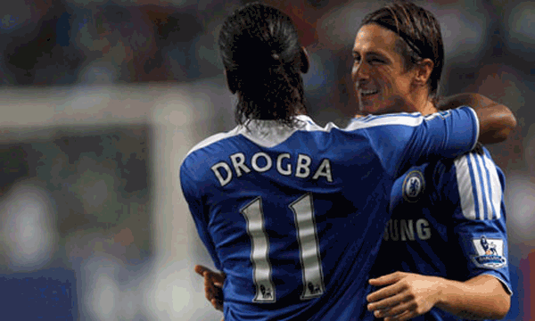Fernando Torres is congratulated by Chelsea team mate Didier Drogba after he scored a goal against Aston Villa in the Asia Trophy final in Hong Kong. (REUTERS)
