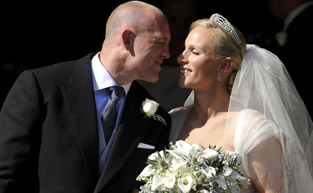 England rugby captain Mike Tindall and Zara Phillips kiss as they leave the church after their marriage at Canongate Kirk on July 30, 2011 in Edinburgh, Scotland. The Queen's granddaughter Zara Phillips will marry England rugby player Mike Tindall today at Canongate Kirk. Many royals are expected to attend including the Duke and Duchess of Cambridge. (GETTY)