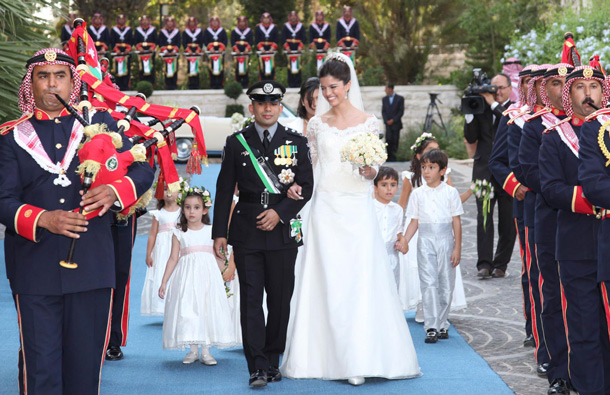 Jordan's Prince Rashid bin El Hassan walks with his bride Princess Zeina during their wedding ceremony at Bassman Palace in Amman. (REUTERS)