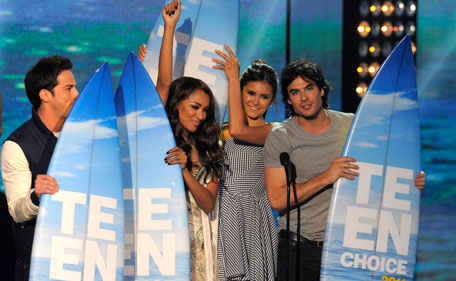 Members of the cast of "Vampire Diaries" accept the choice TV show: sci-fi/fantasy award at the Teen Choice Awards on Sunday, Aug. 7, 2011 in Universal City, Calif.  (AP)