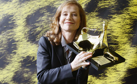 Actress Isabelle Huppert poses with the Moet & Chandon Excellent Award during the 64th Festival del Film di Locarno on  August 7, 2011 in Locarno, Switzerland. (GETTY)