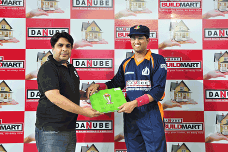 Danube’s CTK Mashud receiving the Man of the Match award for his outstanding bowling performance against Fly Emirates. (SUPPLIED)