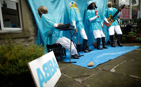 Characters dressed as the band ABBA stand as part of the annual scarecrow festival on August 13, 2011 in Kettlewell, England. During the two week festival the rural Yorkshire Dales village comes to life with both traditional scarecrows and more modern takes, including parodies of current affairs and celebrites. (GETTY)
