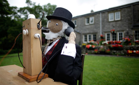 A scarecrow making a telephone call is displayed as part of the annual scarecrow festival on August 13, 2011 in Kettlewell, England. During the two week festival the rural Yorkshire Dales village comes to life with both traditional scarecrows and more modern takes, including parodies of current affairs and celebrities. (GETTY)