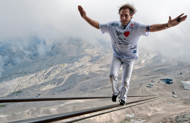 High wire artist Freddy Nock balances as he walks up on the rope of a Zugspitze cable car in Grainau near Garmisch-Partenkirchen, southern Germany. (AP)