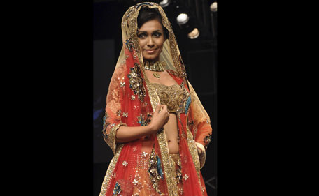 An Indian model walks the ramp for designer Neeta Lulla on the fourth day of Lakme Fashion Week (LFW) Winter/Festival 2011 in Mumbai on August 20, 2011. (AFP)